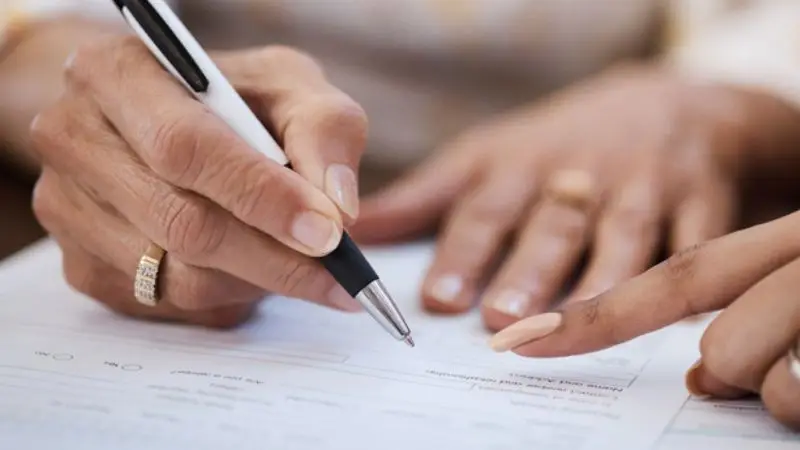 a person signing a document