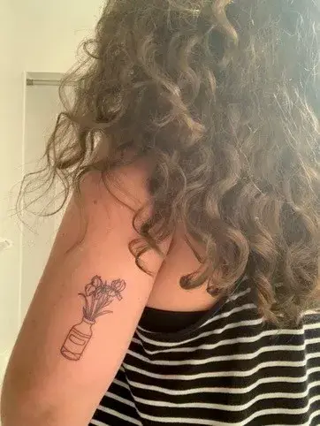 a person with a tattoo on their arm