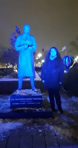 a man and woman standing in blue light