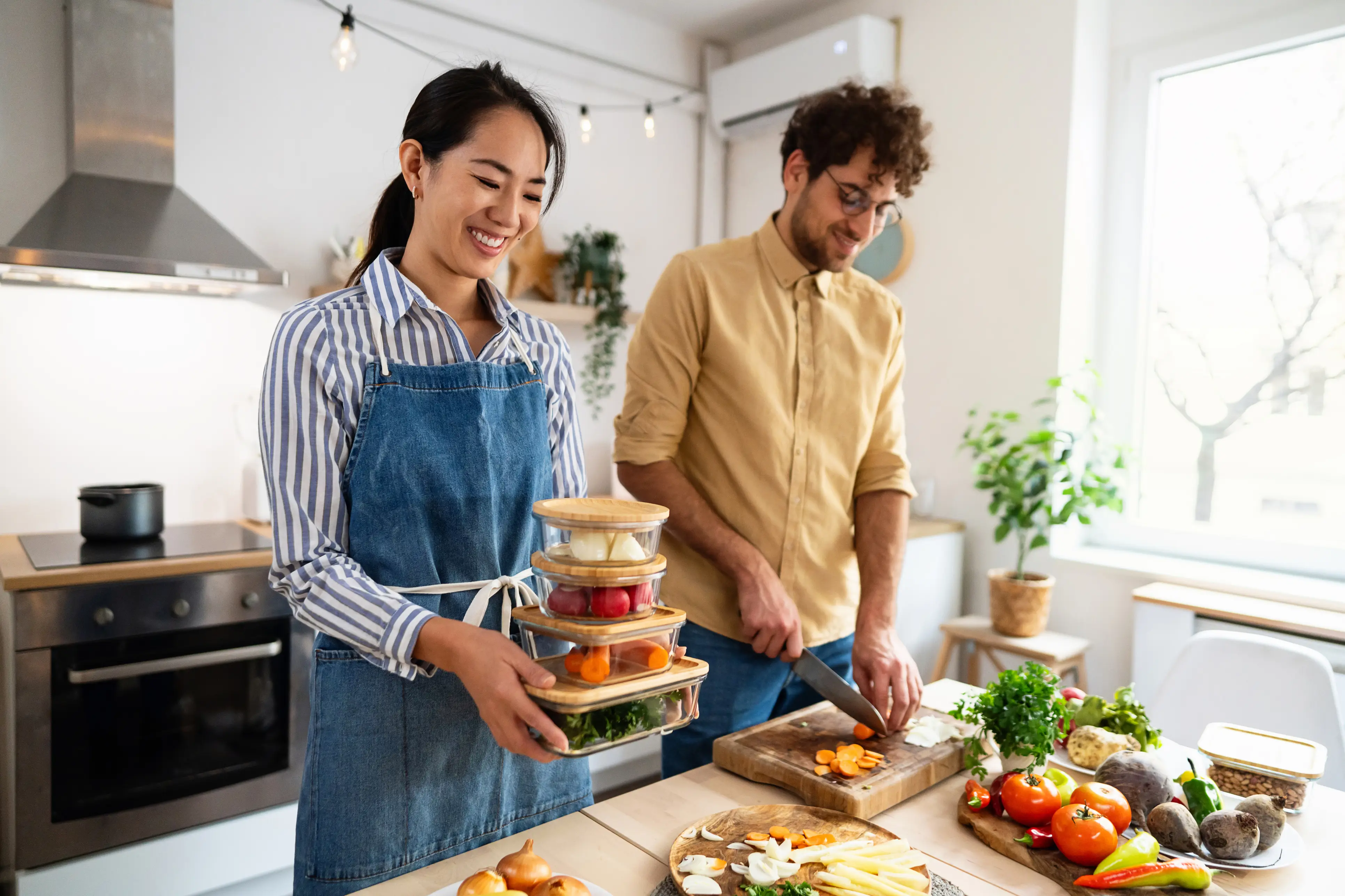 a man and woman in a kitchen