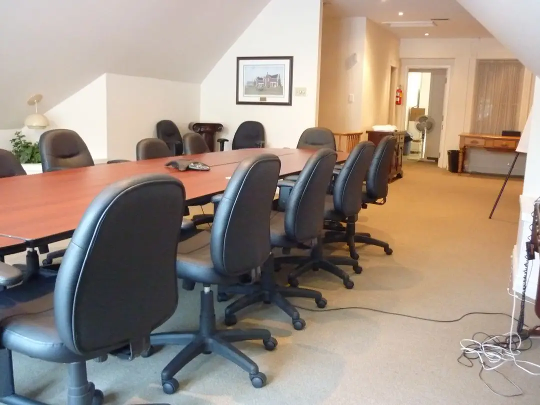 a conference room with a table and chairs