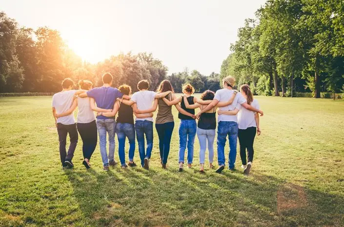 a group of people walking in a line
