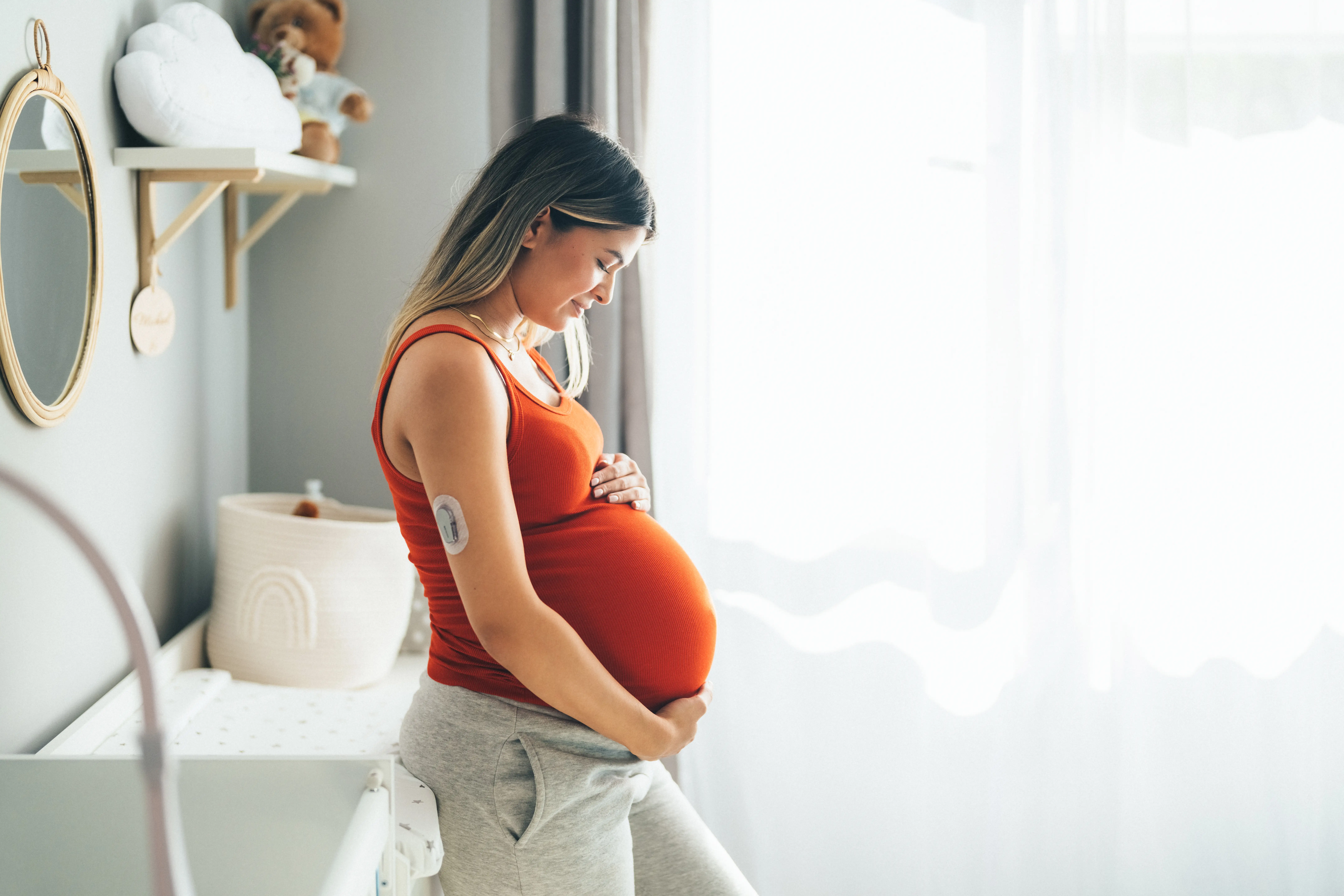 a pregnant woman holding her belly