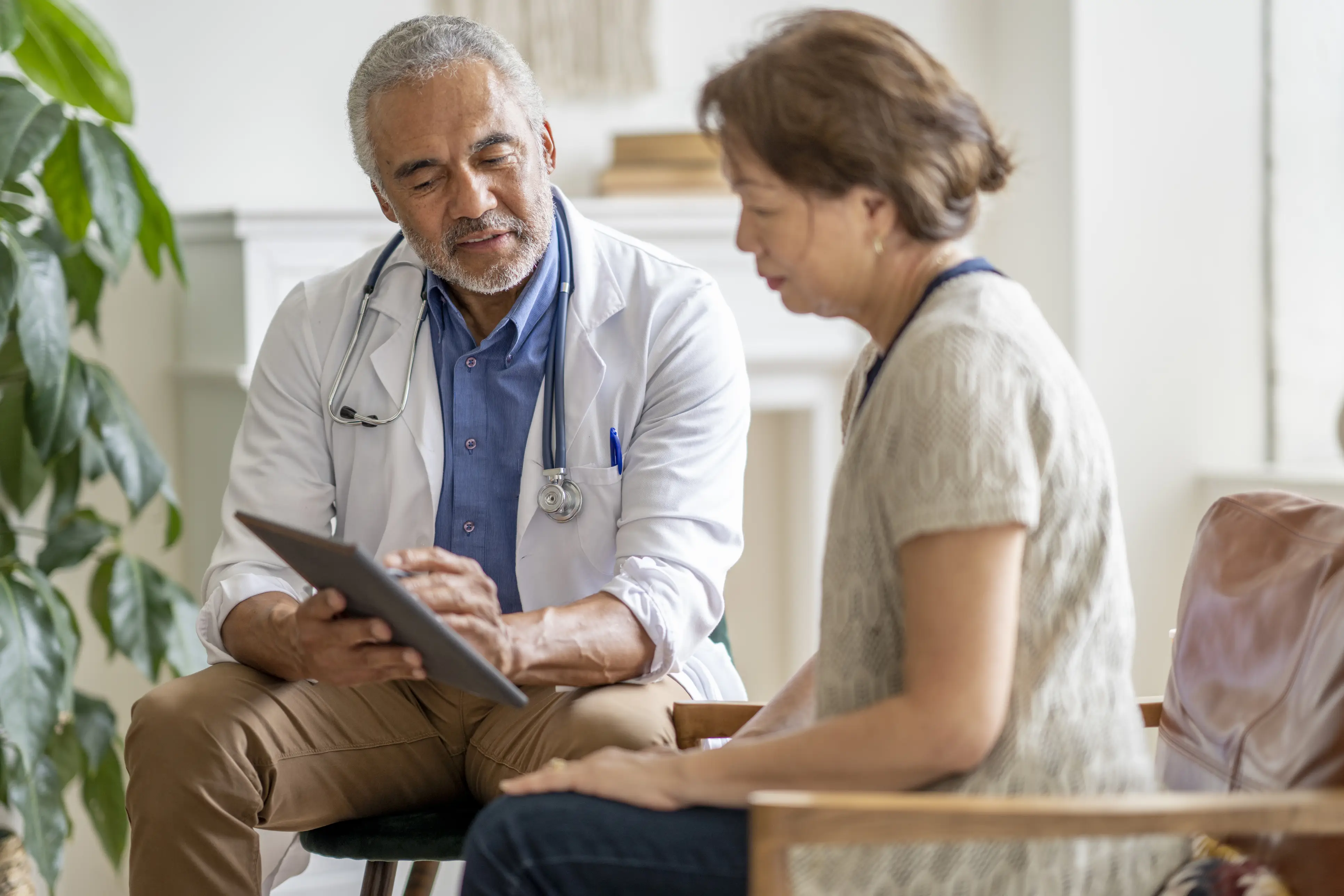 a doctor looking at a tablet