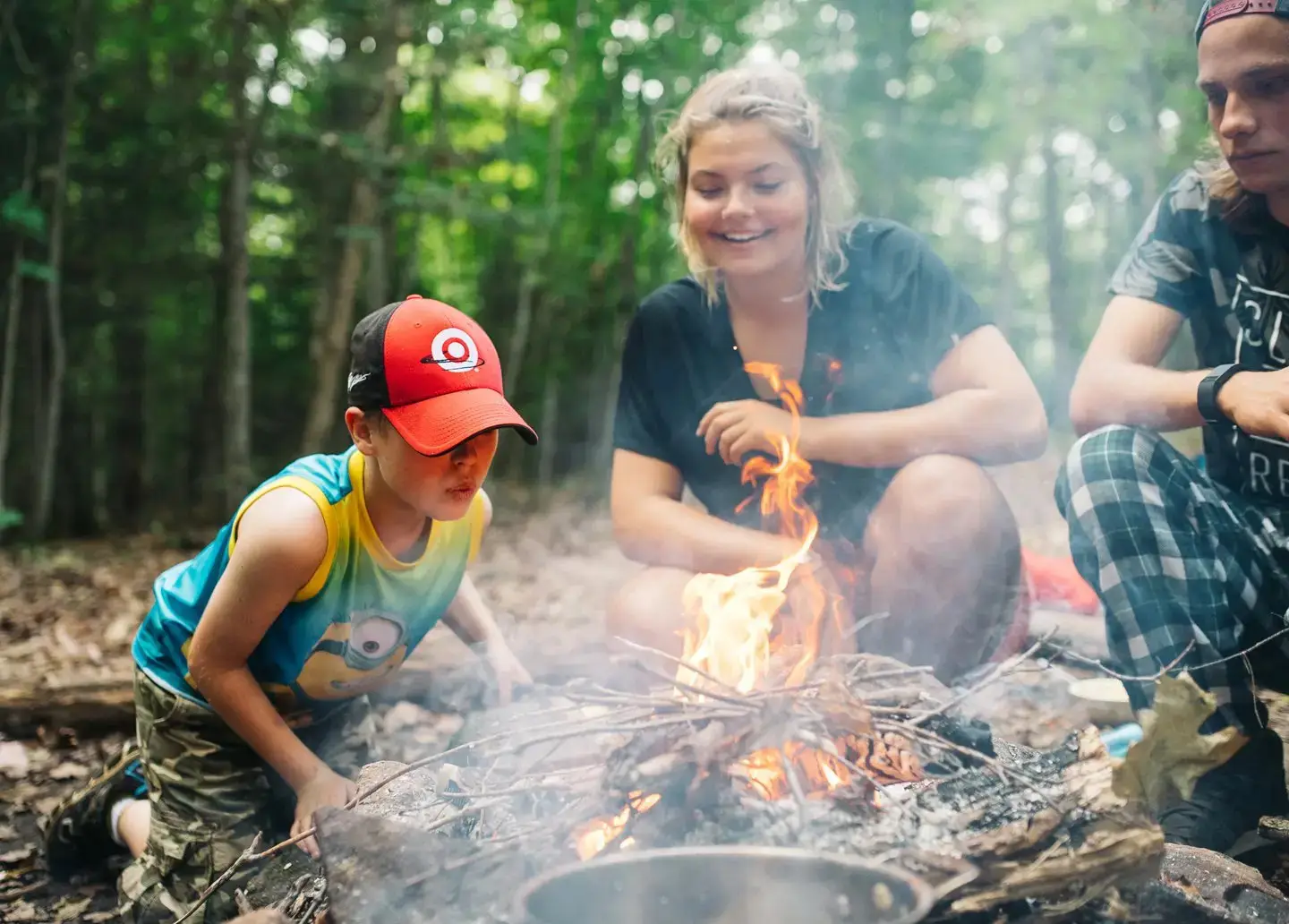 a group of people around a fire
