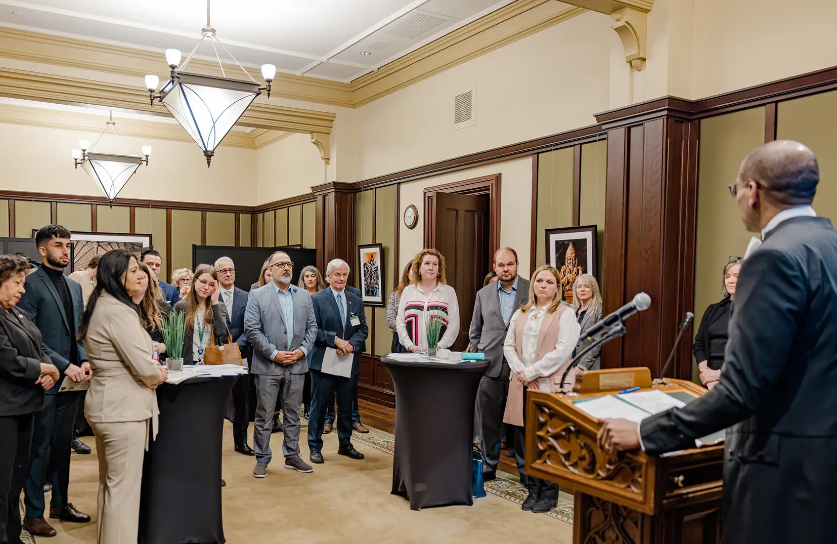 a group of people standing at a podium