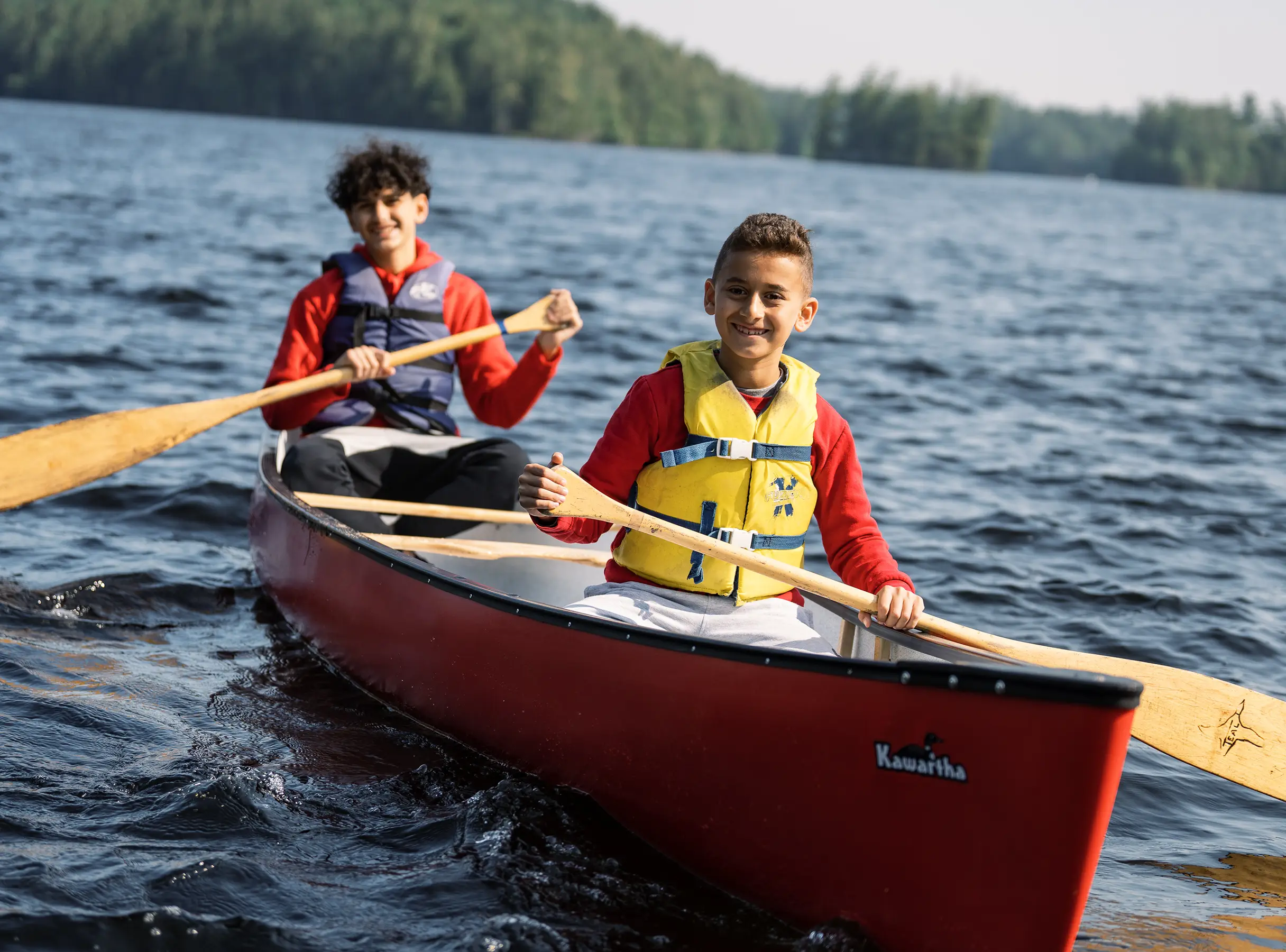 two boys in a canoe