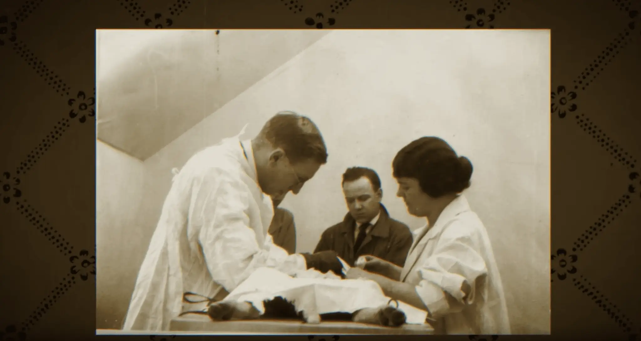 a group of people looking at a baby