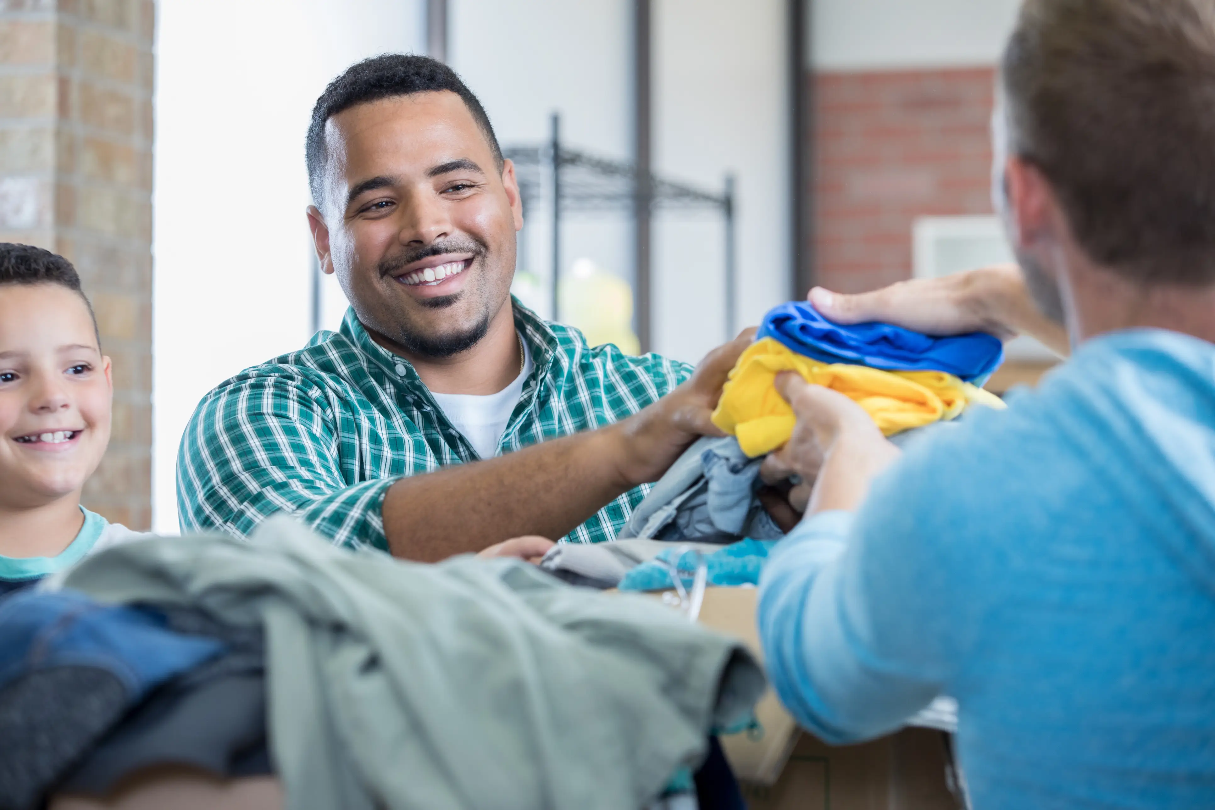 a man smiling at another man