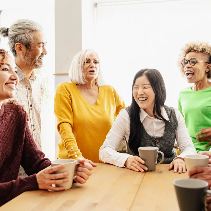 a group of people sitting around a table