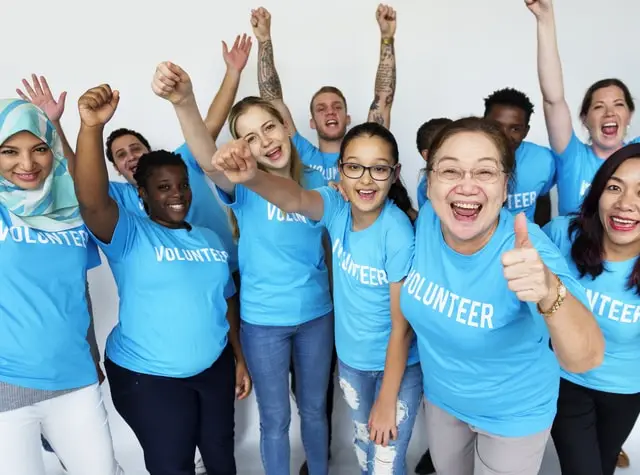 a group of people wearing blue shirts