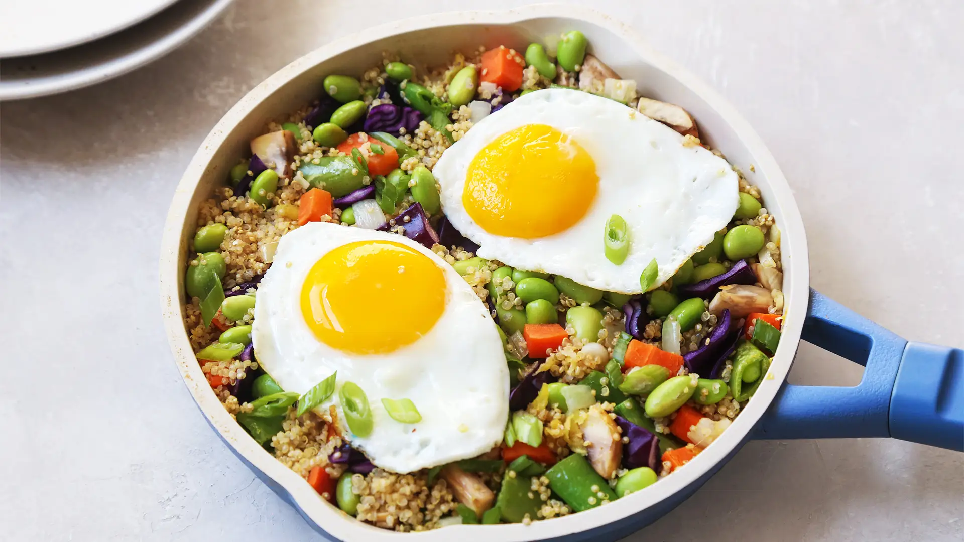 a bowl of food with eggs and vegetables