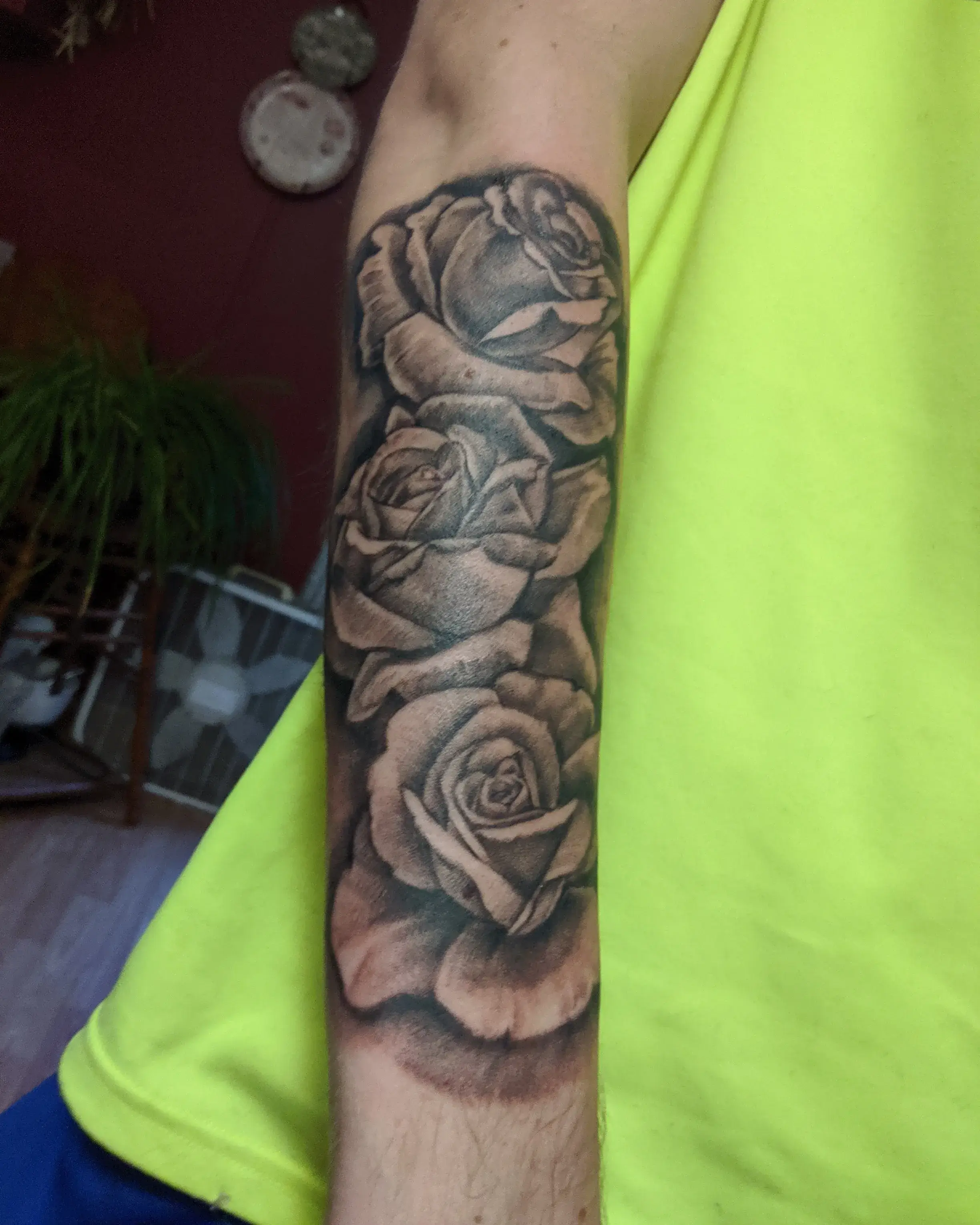 a person's arm with a tattoo of roses