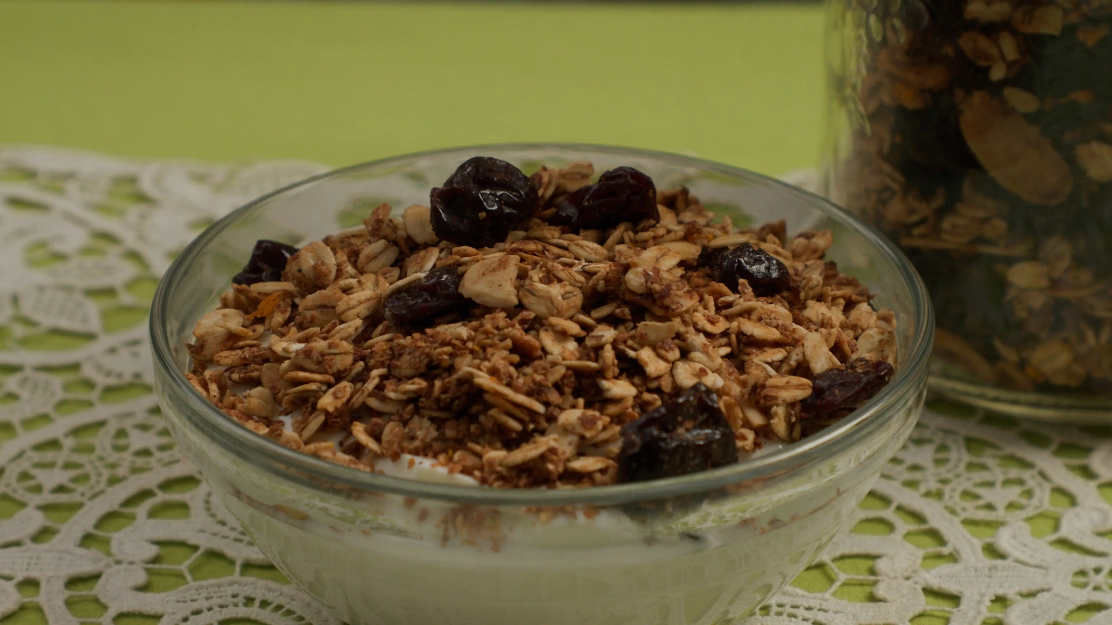 a bowl of oatmeal with raisins and yogurt