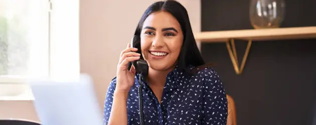a woman holding a phone to her ear