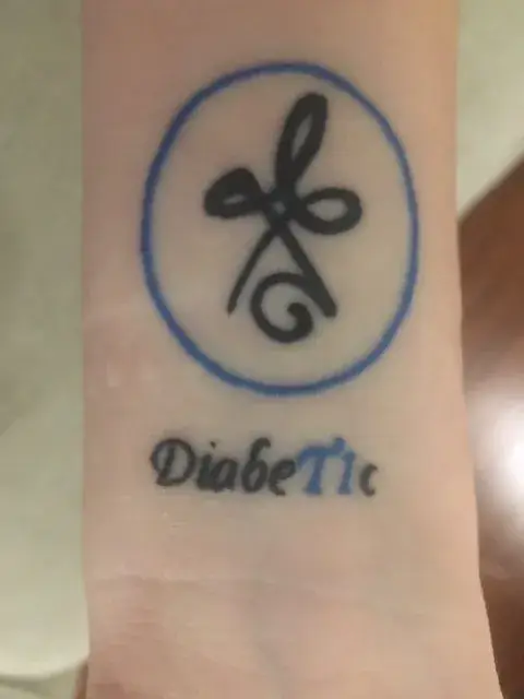 a tattoo on a wrist