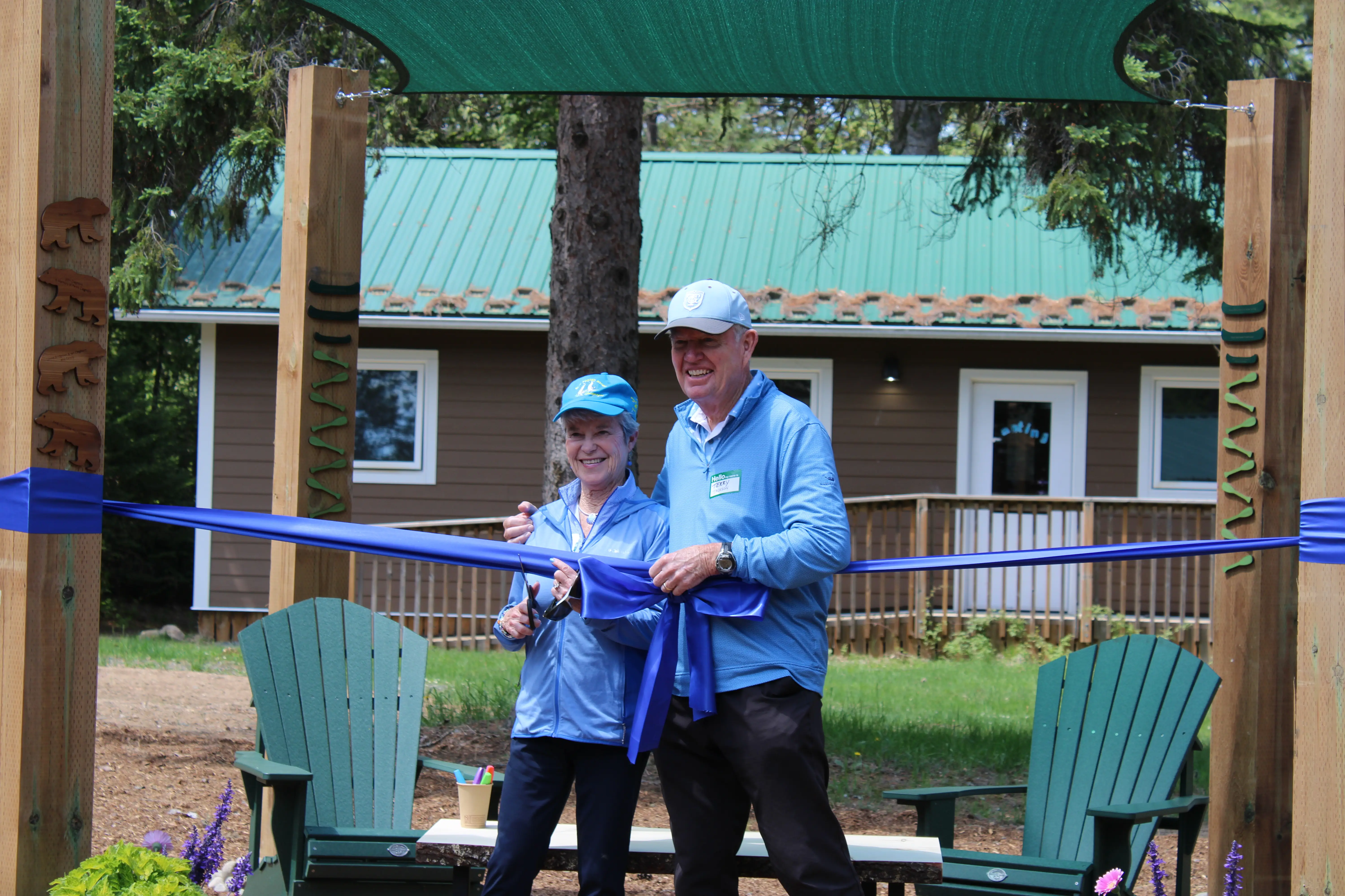 a man and woman cutting a ribbon