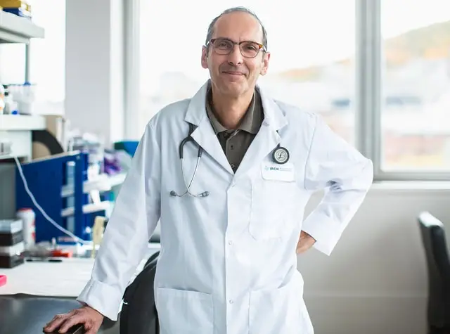 a man in a white lab coat