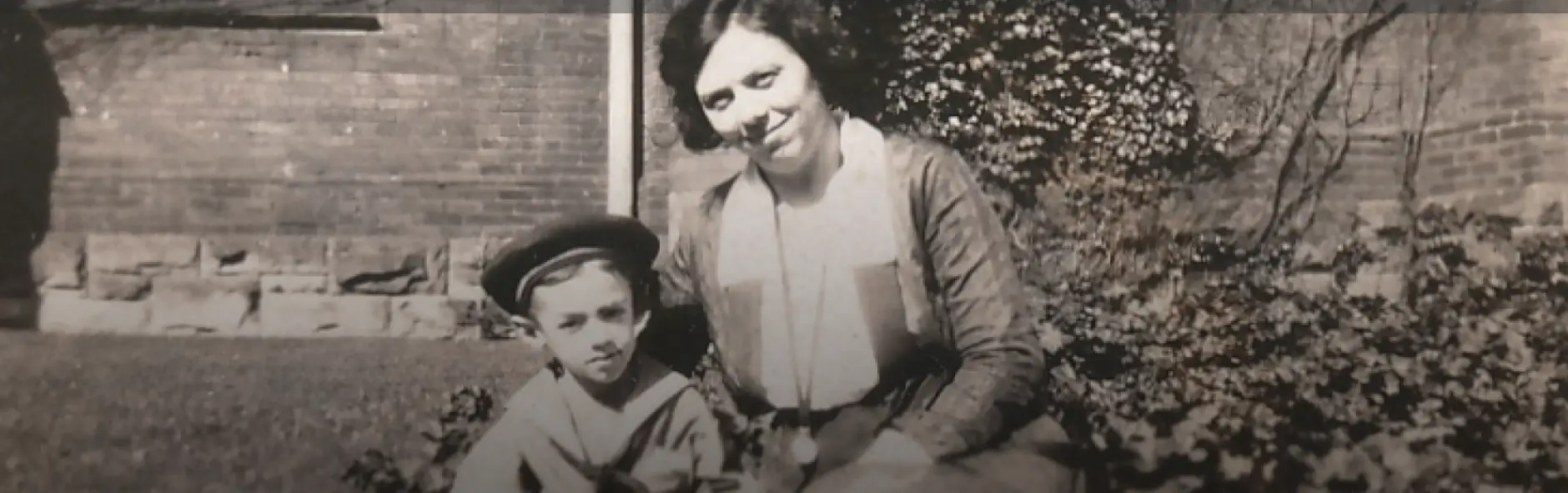 a woman and a boy posing for a picture