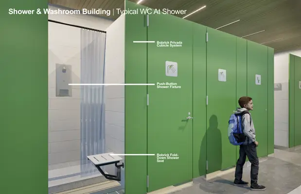 a person standing in front of a green bathroom