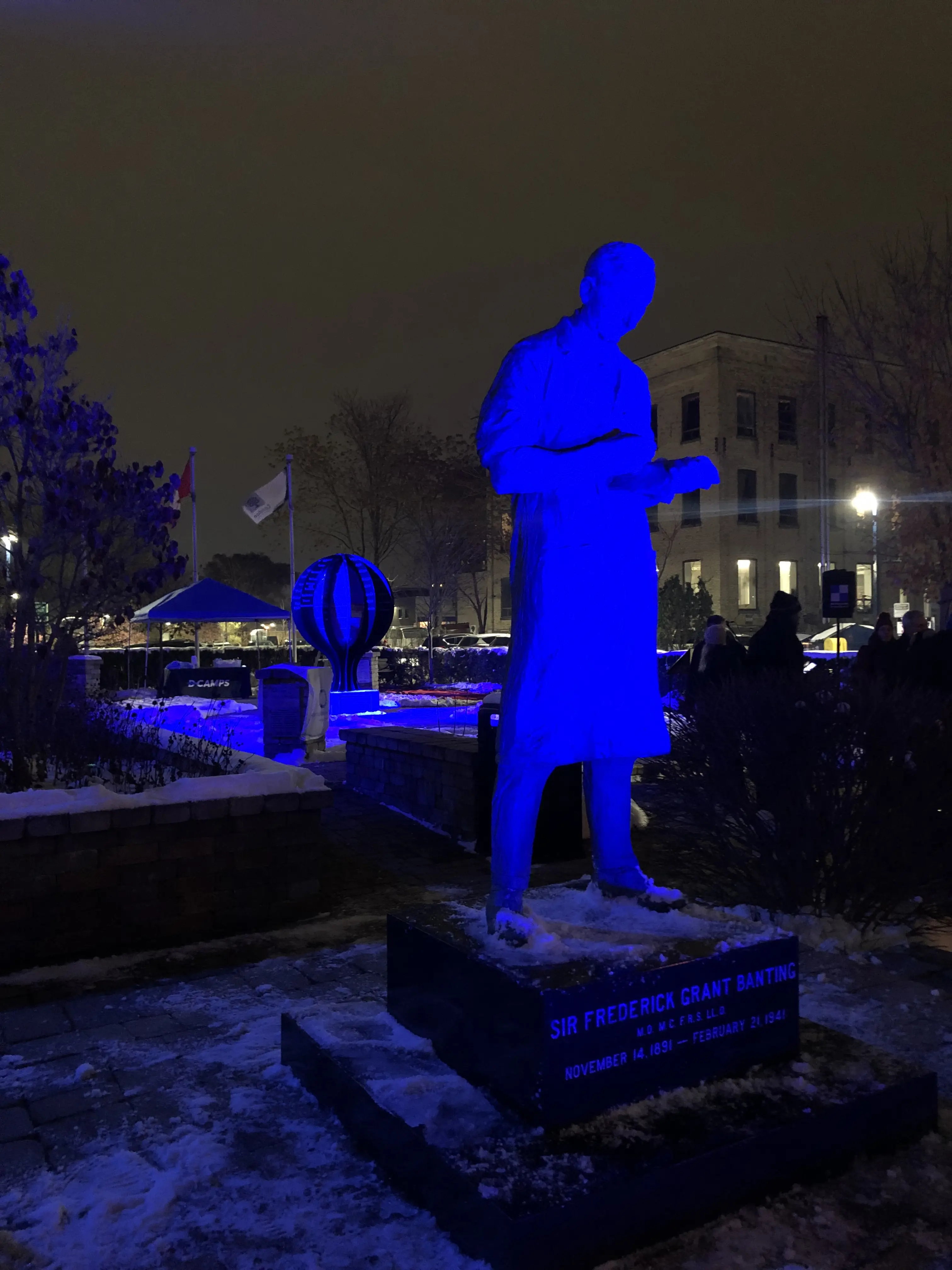 a statue of a man in a blue light