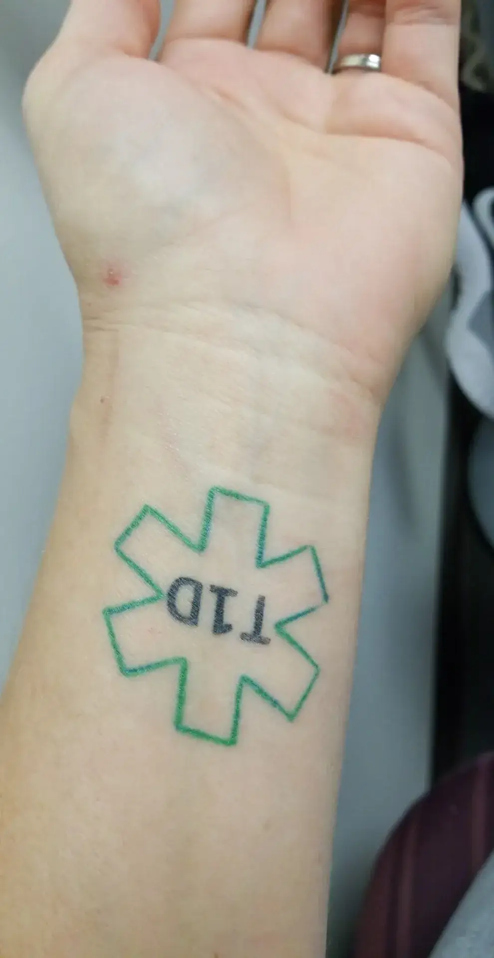 a tattoo on a wrist