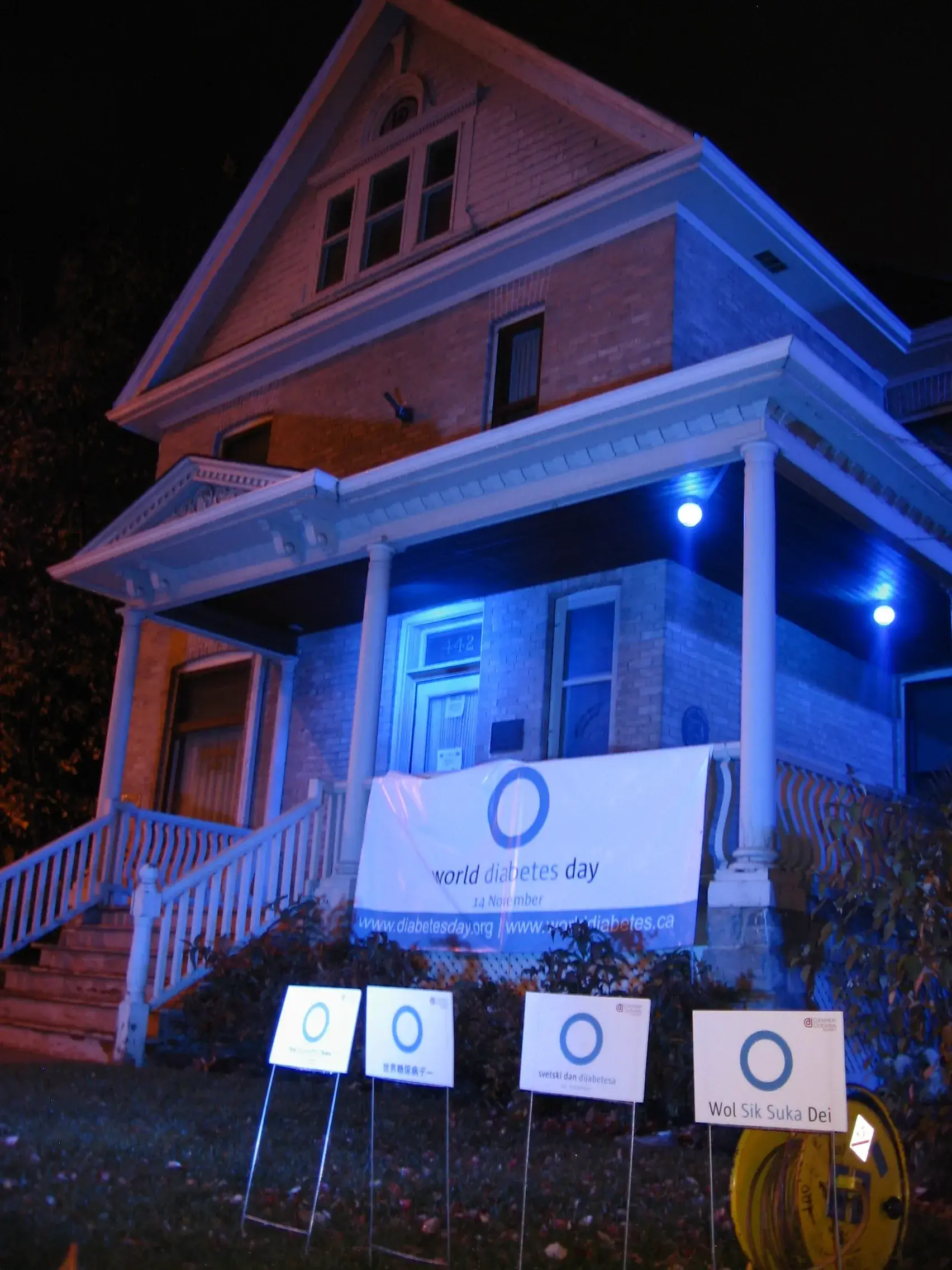 a house with signs on the front porch
