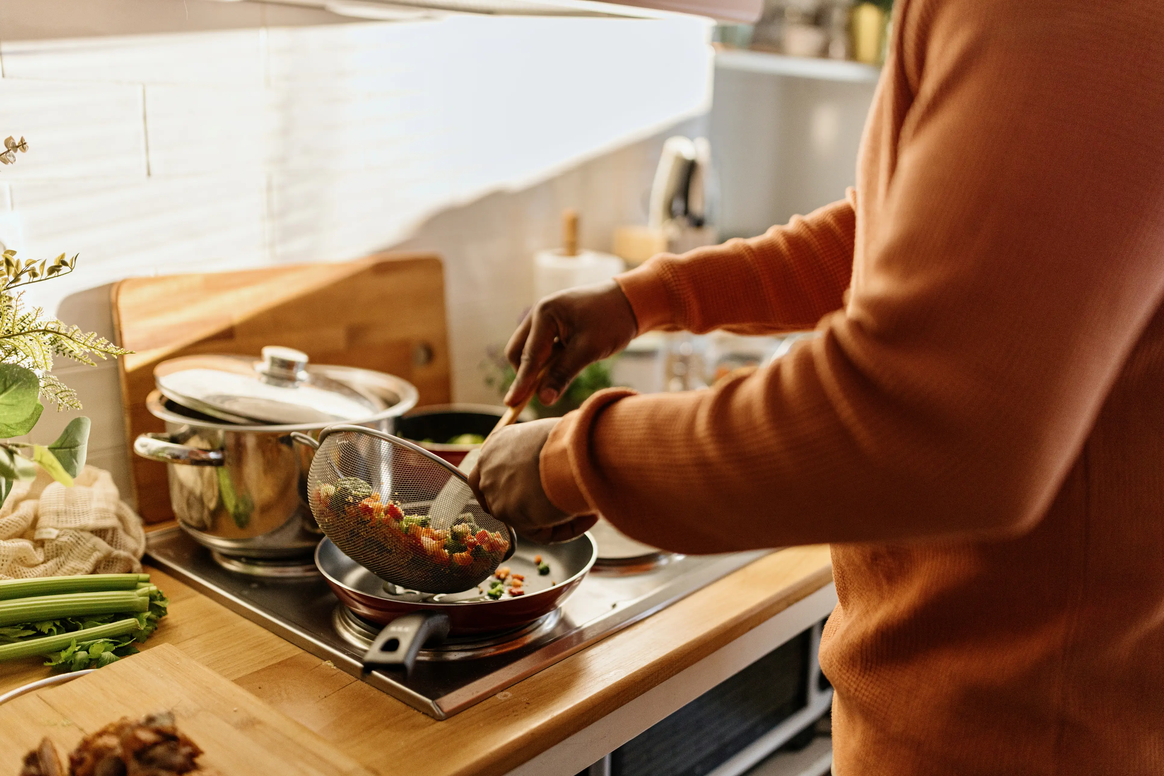 a person cooking food in a kitchen
