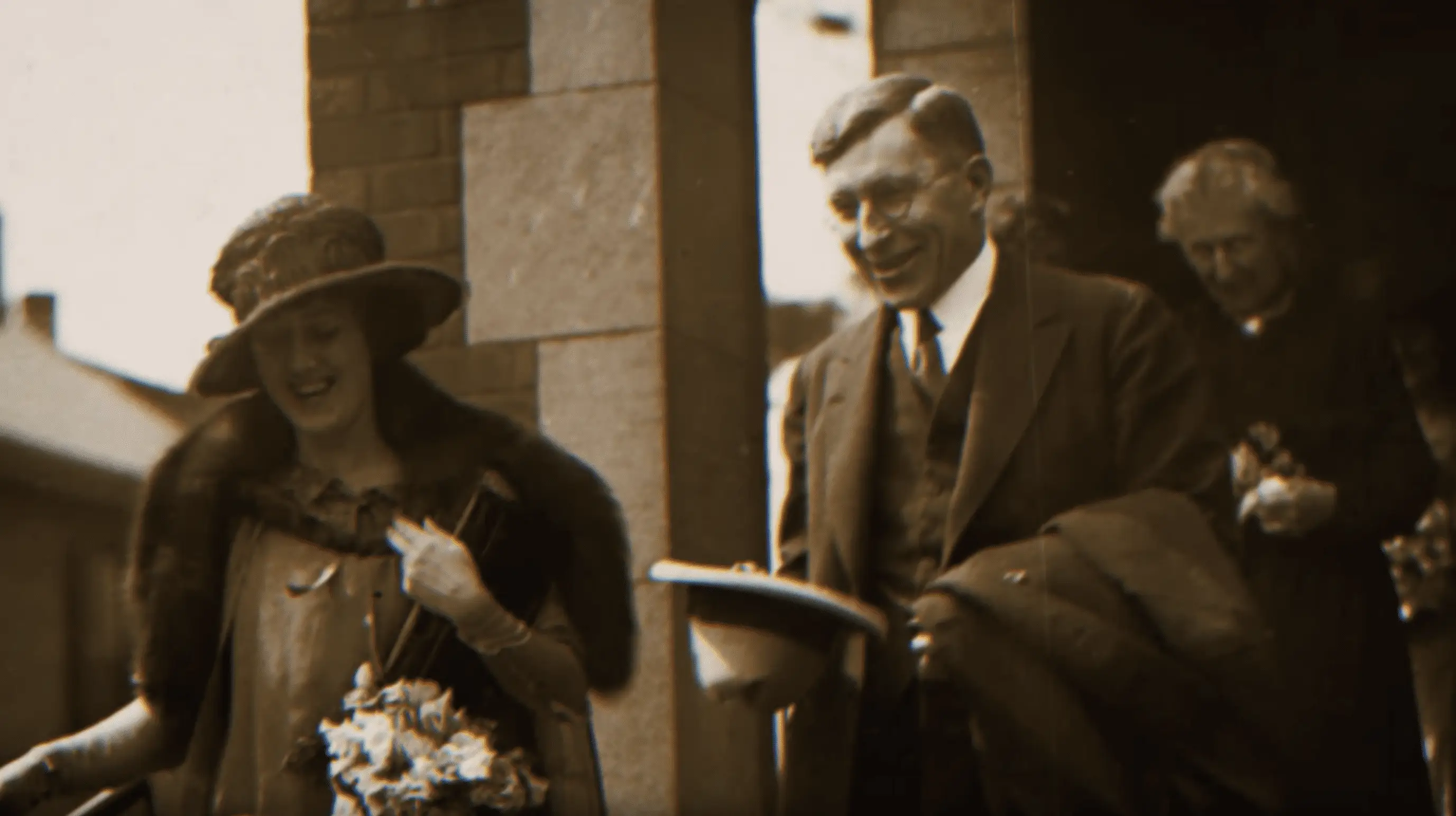 a man and woman walking down a sidewalk