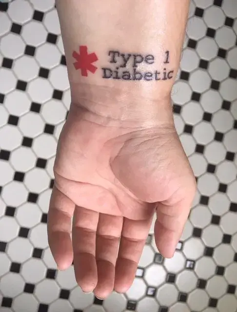 a hand with a tattoo on it