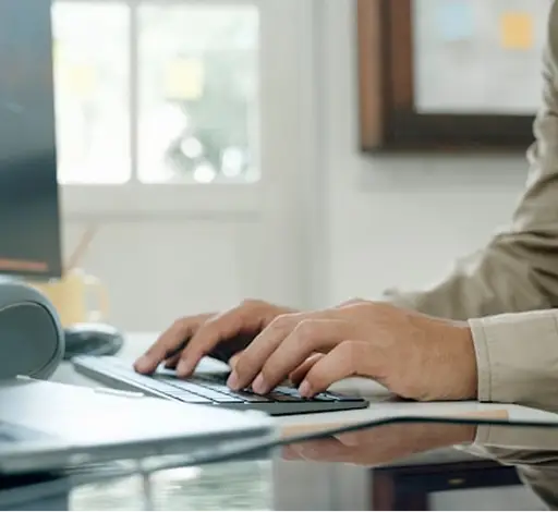 a person typing on a keyboard