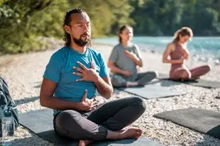 a group of people doing yoga