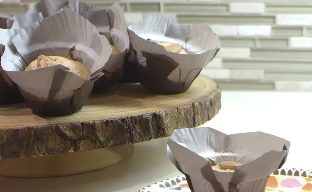 a group of muffins in paper wrappers