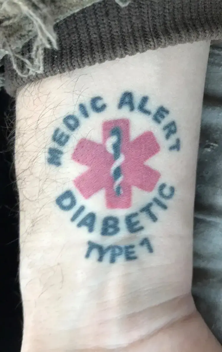 a tattoo on a person's wrist