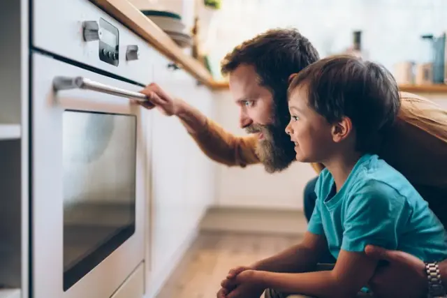 father-and-son-cooking-dinner-at-home-picture-id1203794009 father-and-son-cooking-dinner-at-home-picture-id1203794009