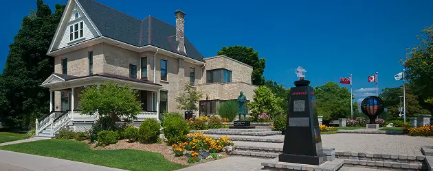 a large building with a statue in front of it
