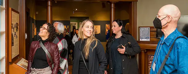 a group of women standing in a room