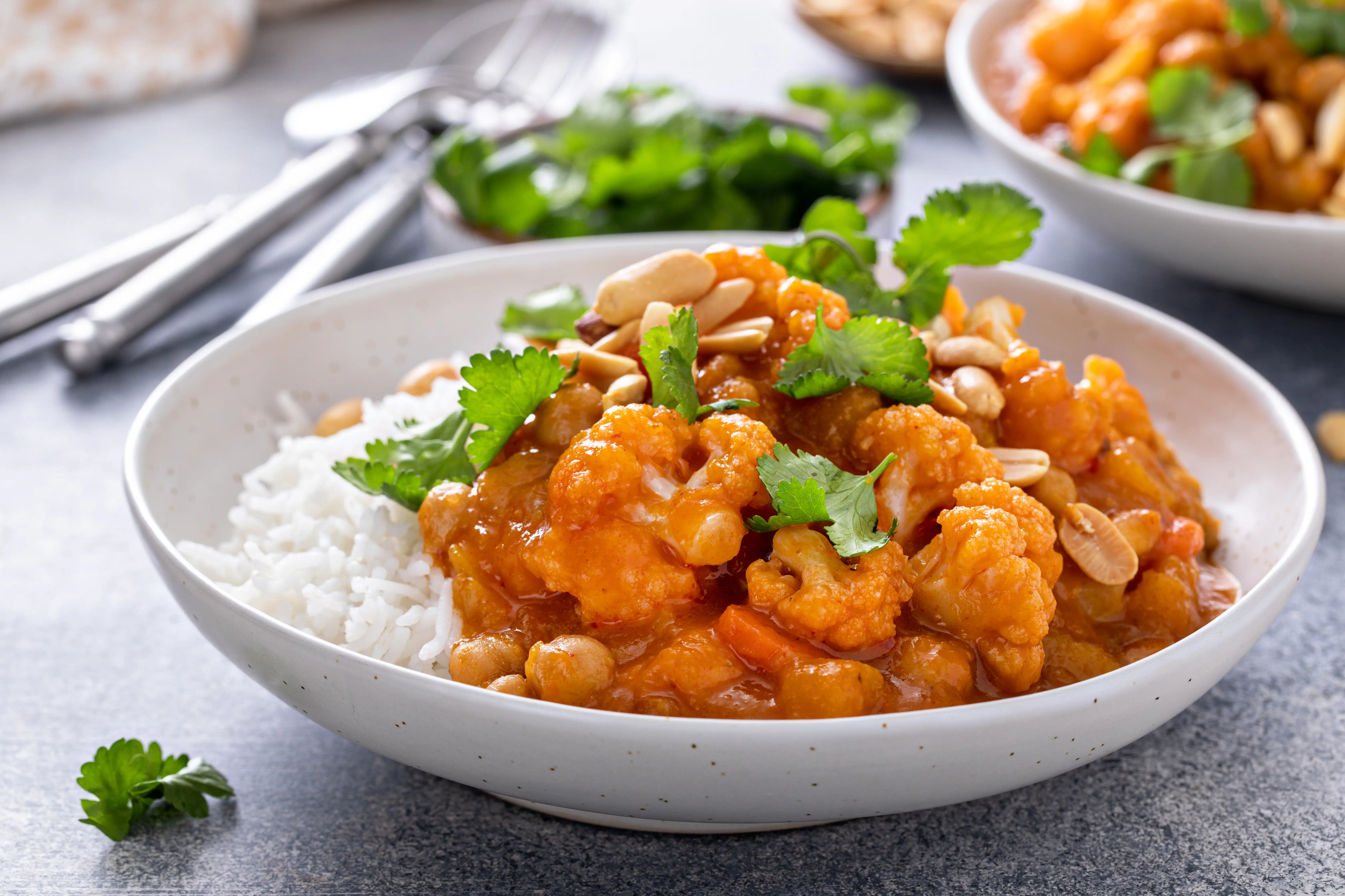 a bowl of food with rice and vegetables