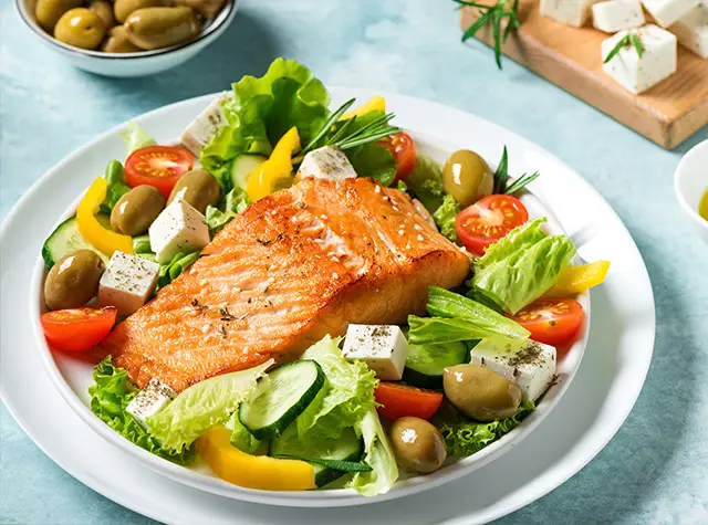 Grilled salmon and chopped Greek salad for two