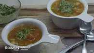 two bowls of soup on a table