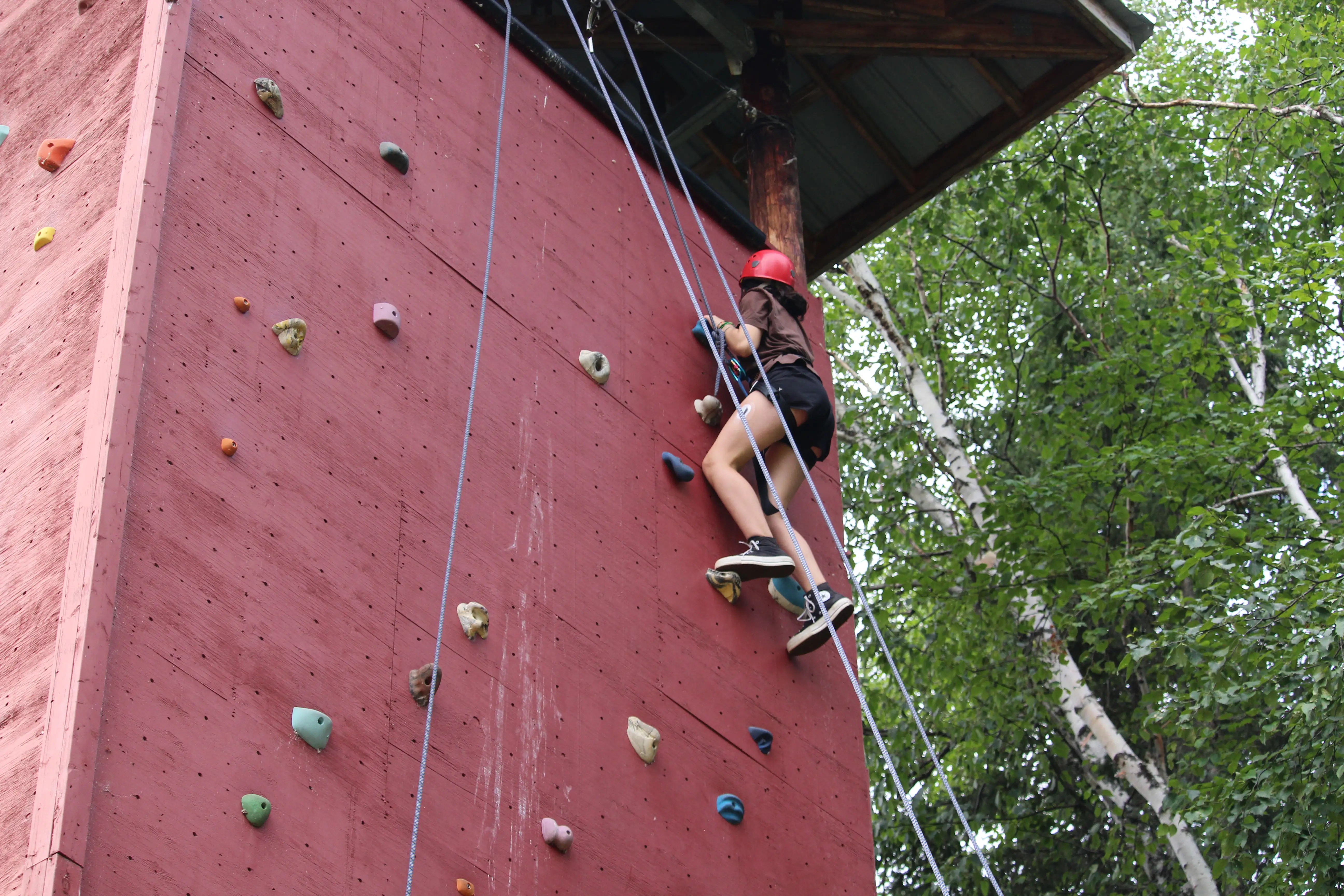 a person climbing a rock wall