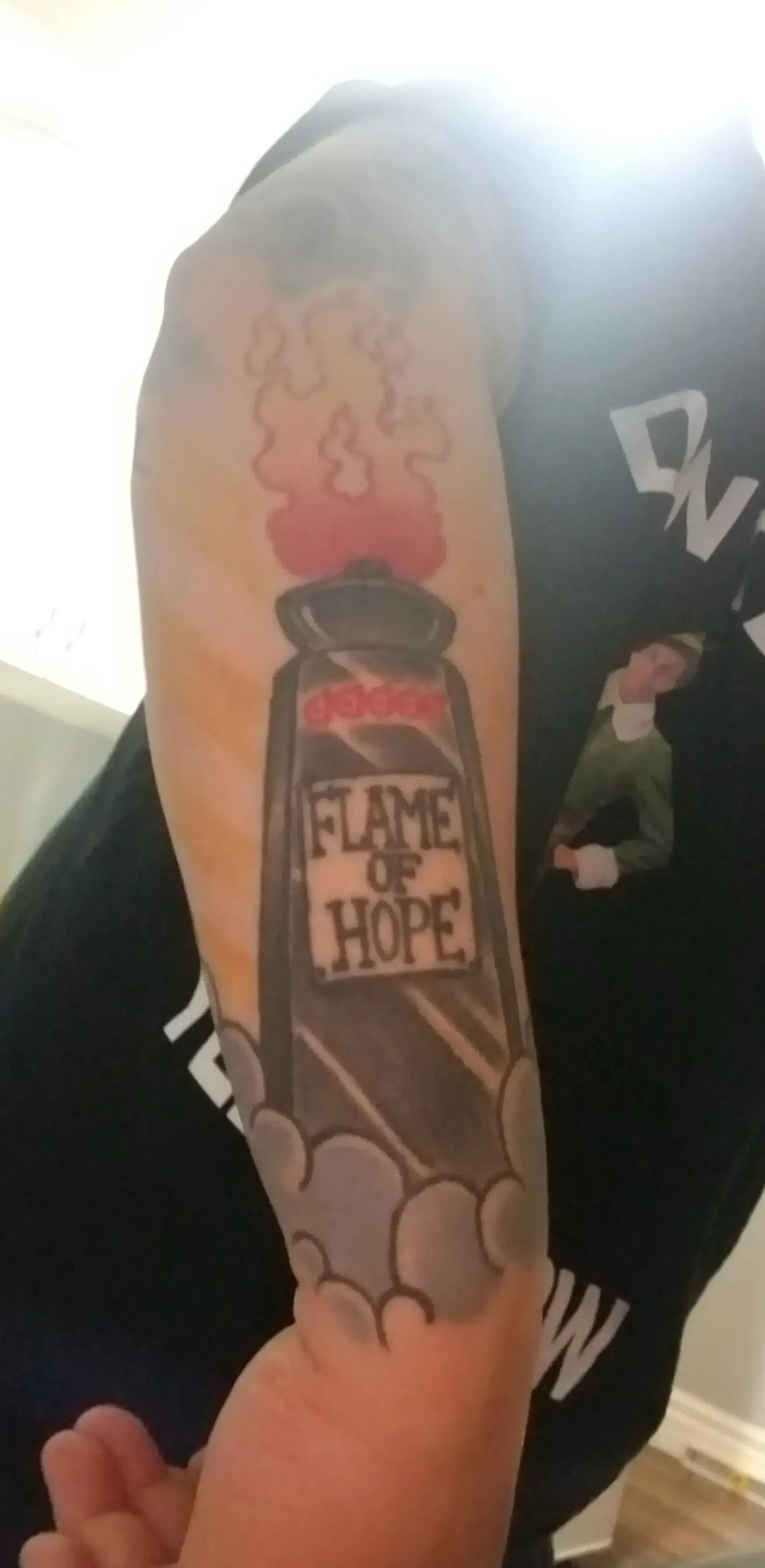 a person's arm with a tattoo on it