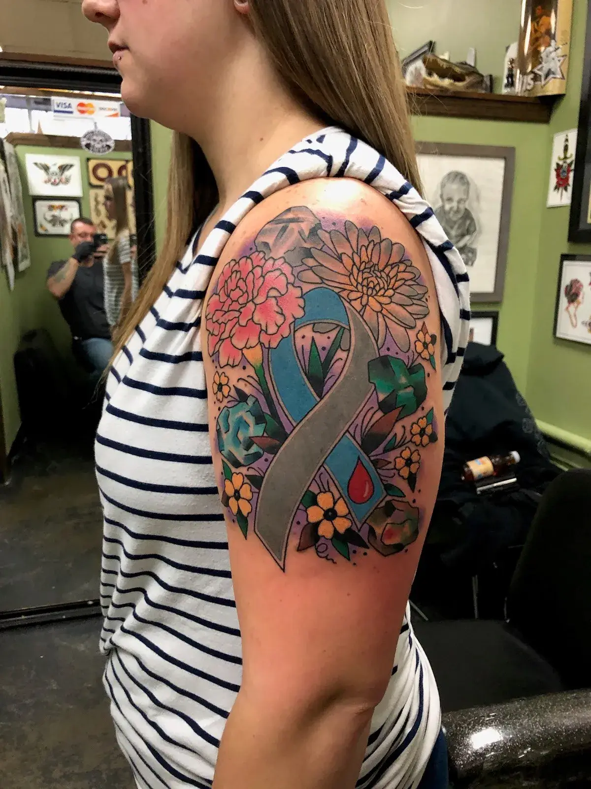 a woman with a tattoo on her arm