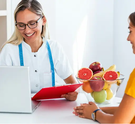 a woman looking at a laptop