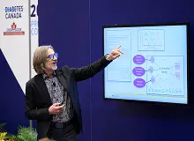 a man pointing at a screen