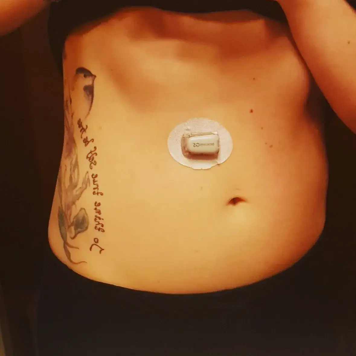 a person's stomach with a patch on it