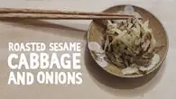 a bowl of cabbage and chopsticks