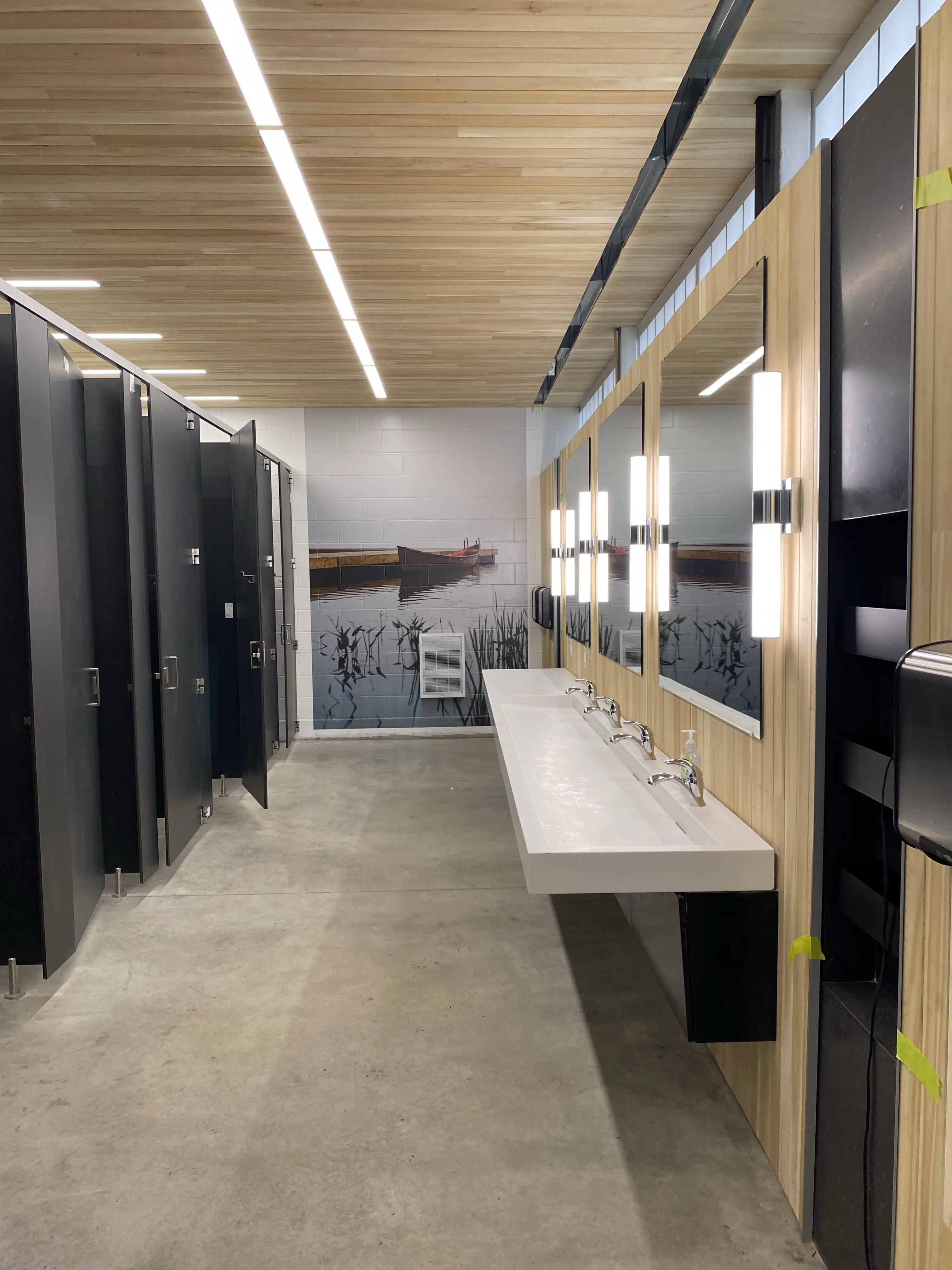 a bathroom with sinks and mirrors