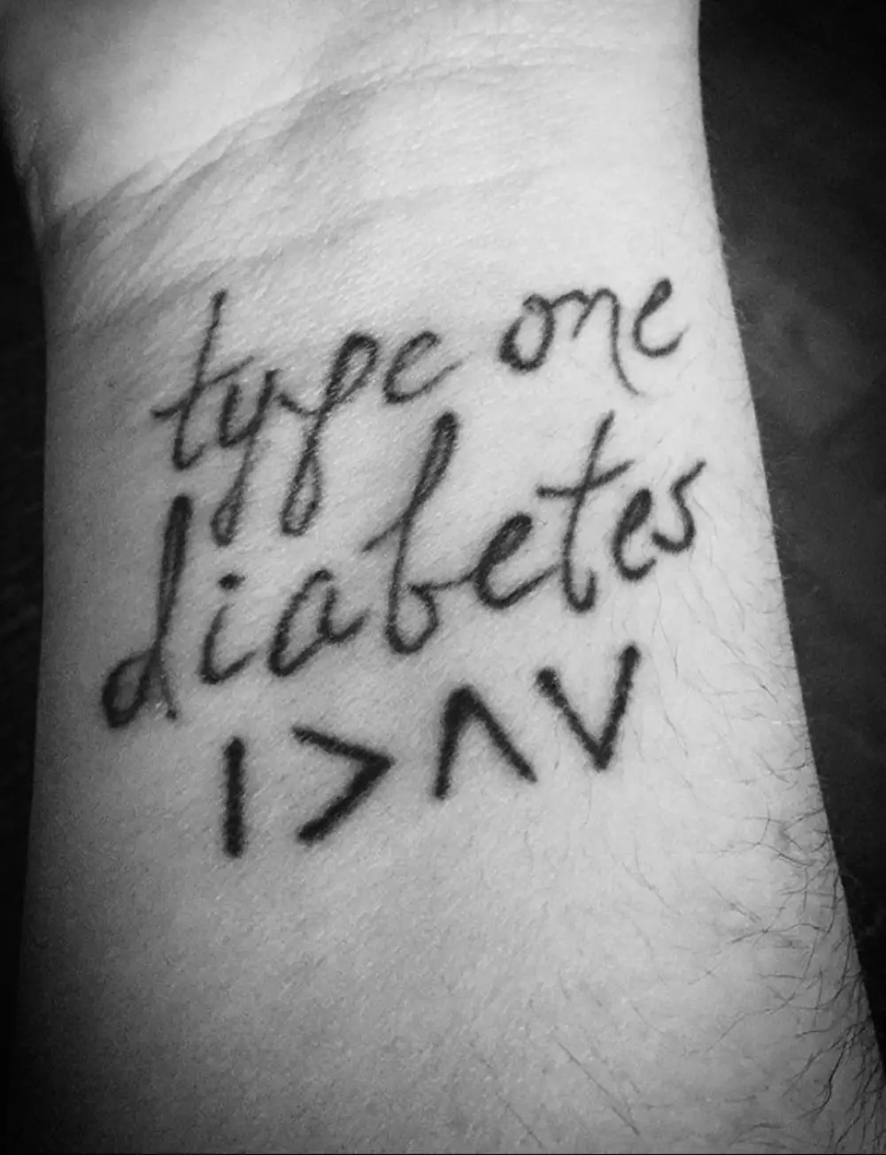 a close up of a wrist with words on it