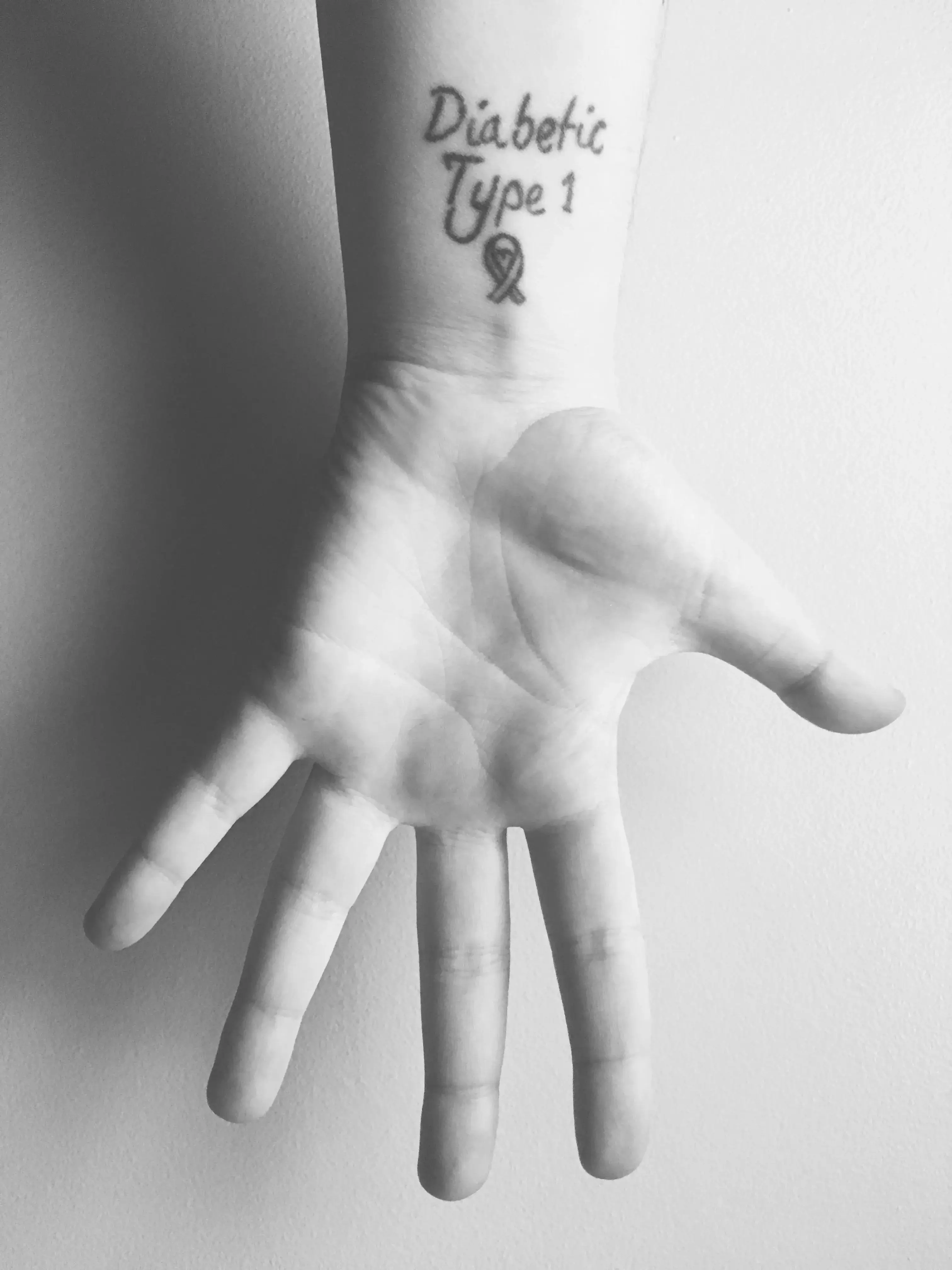 a hand with a tattoo on it